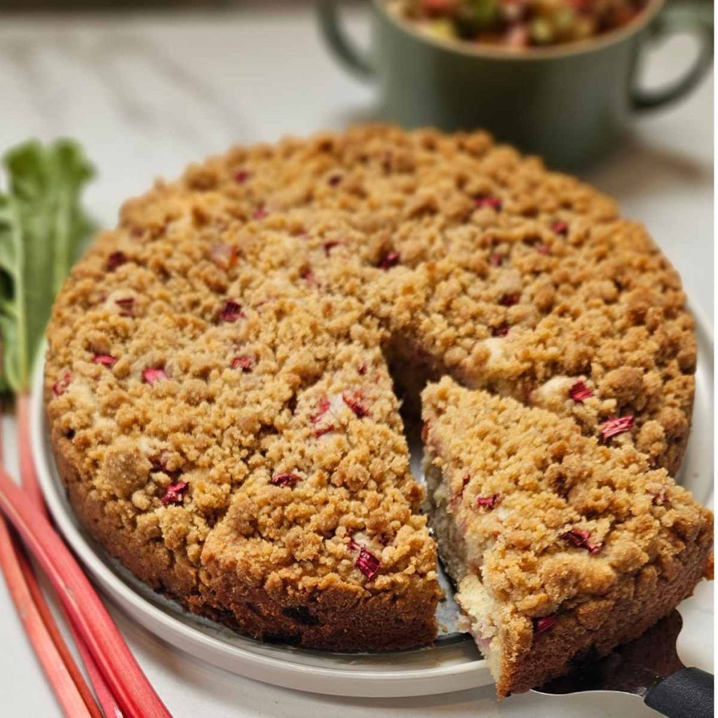 Sourdough rhubarb coffee cake on a white platter